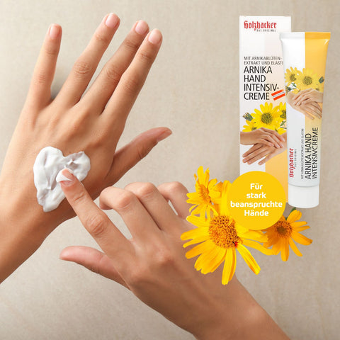 Holzhacker Arnika Hand-Intensiv Creme 75 ml Tube - für stark beanspruchte Hände mit Arnikablütenextrakt. Foto mit Hand und Cremeherz | Naturpräparate Dieterich
