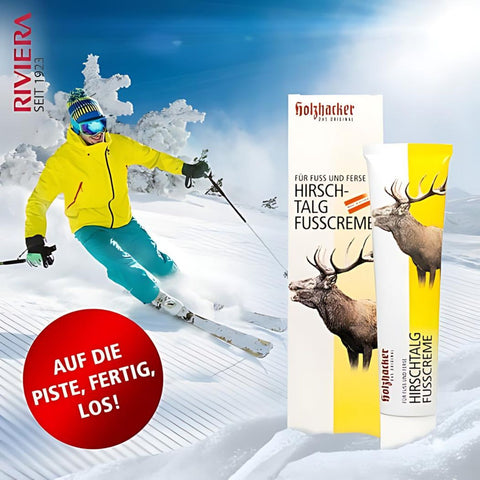 Holzhacker Hirschtalg Fußcreme 75 ml Tube und Umkarton- Foto von Skifahrer auf einer Piste und Text: Auf die Piste fertig, los! | Naturpräparate Dieterich